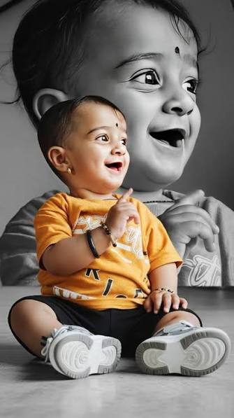 Newborn & Milestone Photography — Joyful Echo: Conceptual Double-Exposure Studio Portrait of Smiling Baby Boy